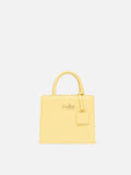 Borsa Shop mini strutturata in pelle liscia giallo tenue con targhetta metallica
